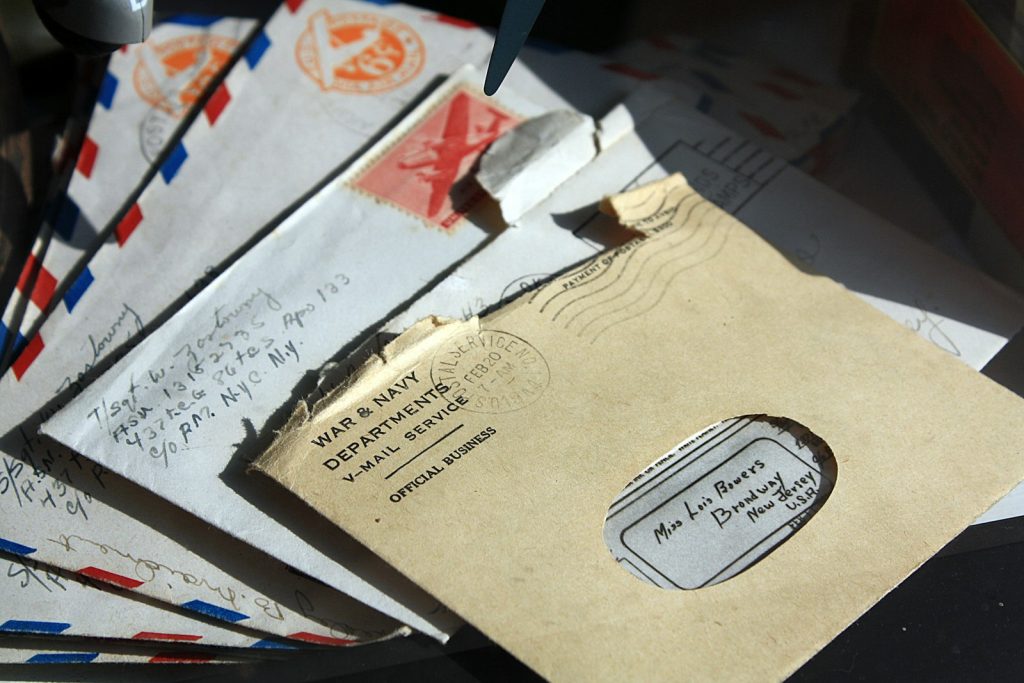 A pile of opened envelopes and letters