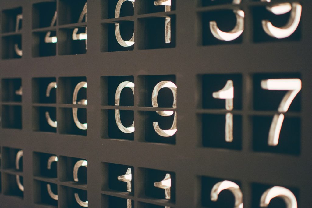 Assorted painted numbers on a wall