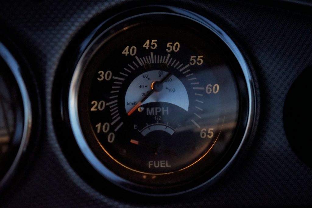 Close-up of a round dashboard gauge